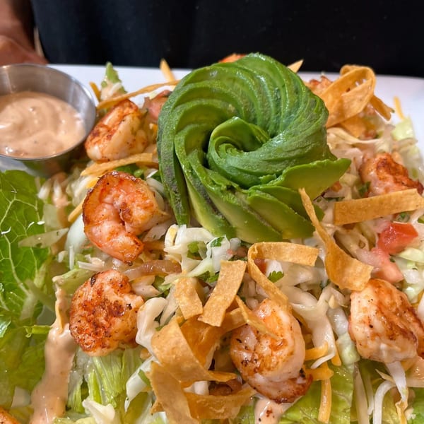 Casa Luna Mexican Cuisine's shrimp salad with avocado, tortilla strips, and creamy dressing.